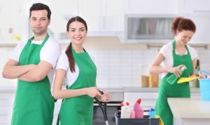 young professionals sprucing up a kitchen
