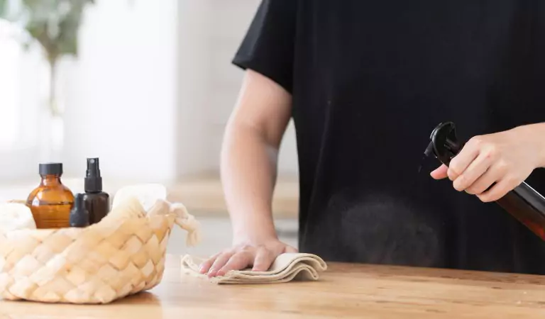 cropped picture of a person cleaning a surface
