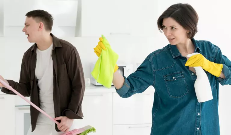 young couple cleaning their house