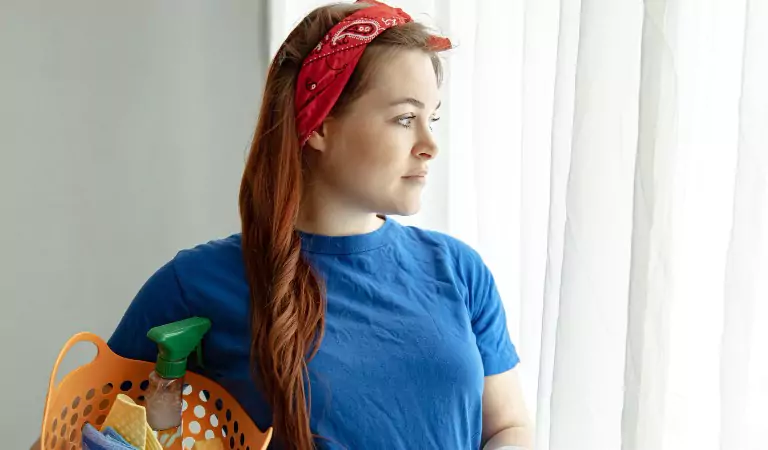 young woman with some cleaning essentials