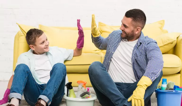 young man with his son ready to clean a house
