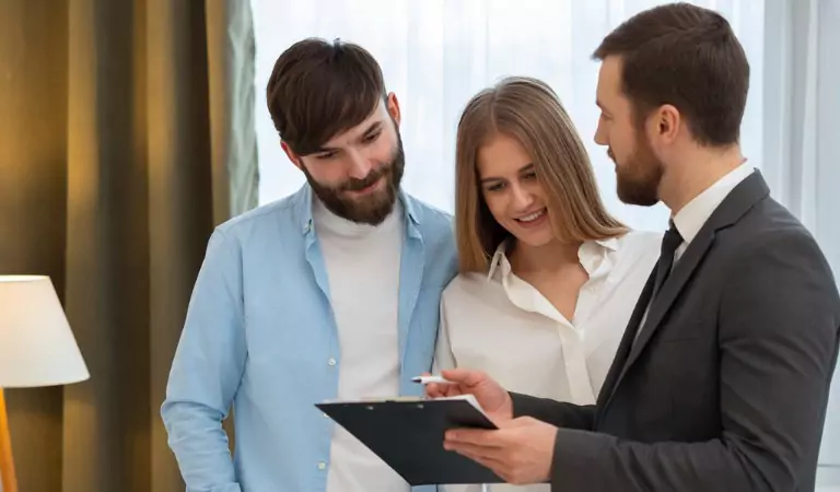 couple inside of a new house with a property advisor