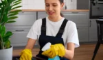 woman disinfecting a surface