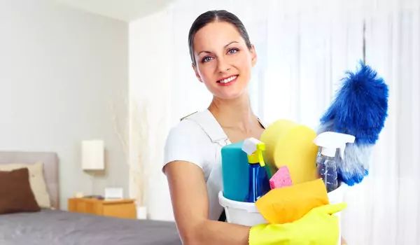 woman with some cleaning product inside of a house