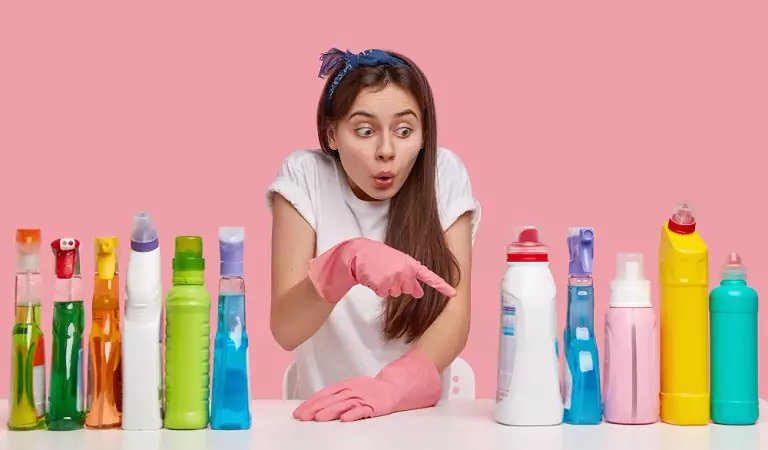 woman with some cleaning supplies