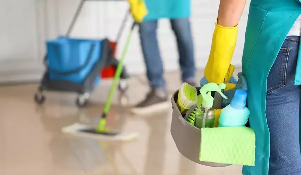 cropped picture of professional cleaners during a job