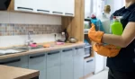 Woman holding cleaning products and products and ready to clean