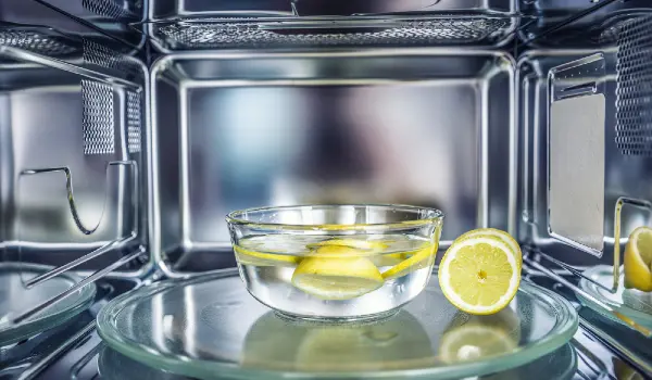 A method of cleaning in a microwave oven with water and lemon