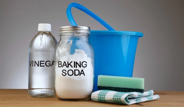 Baking soda with vinegar natural mix for effective house cleaning with cloth and sponge