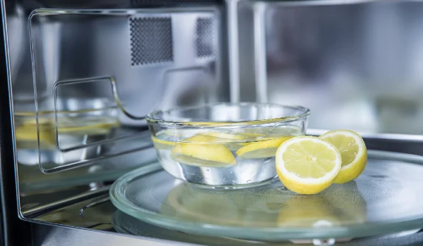 A method of cleaning in a microwave oven with water and lemon