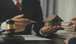 Business and lawyers discussing contract papers with brass scale on desk in office law legal services advice justice and law concept picture with film grain effect
