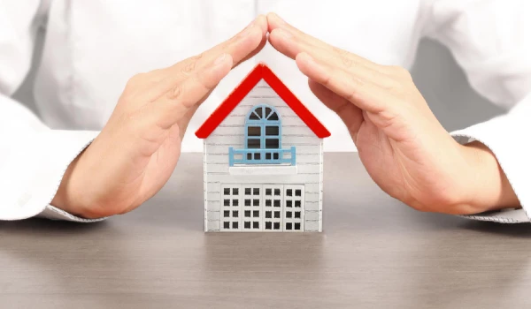 House residential structure under man's hand protection